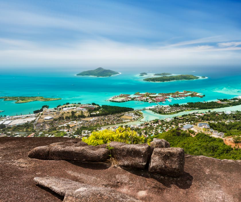 A stunning landscape in Seychelles: crystal-clear waters, scattered islands. ExecuJet adds luxury and seamless travel to this paradise.