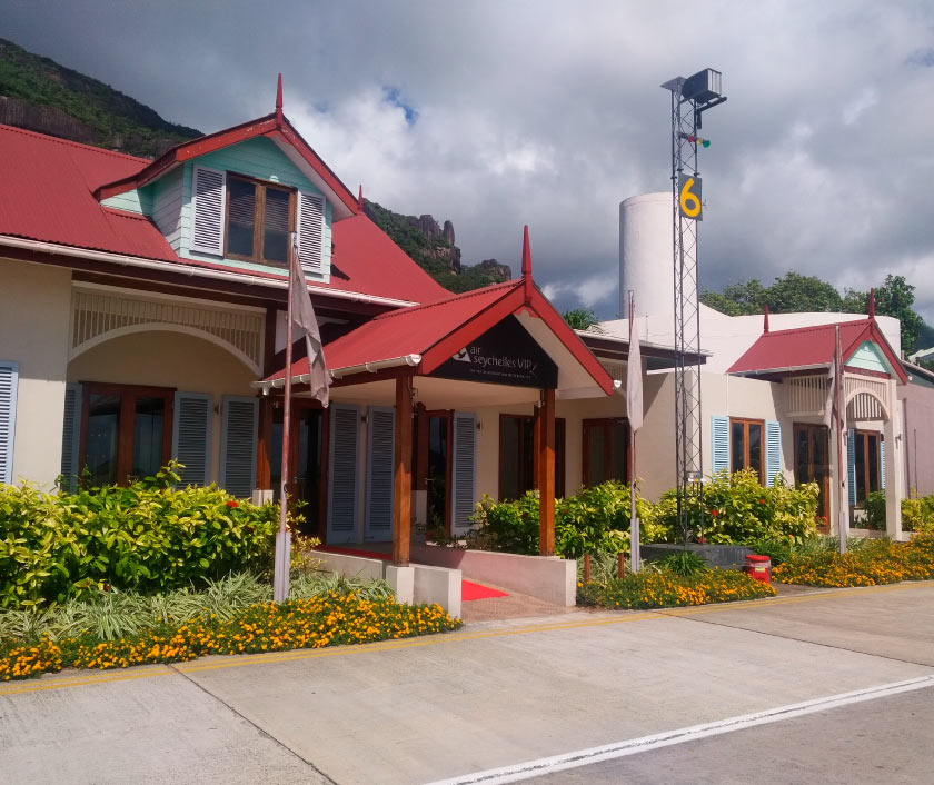 Entrance of our Seychelles FBO facility, with beautiful mountain in the background.