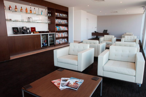 The VIP lounge at Melbourne FBO offers a lavish and inviting space. Luxurious furnishings, including plush seating and modern decor, create an atmosphere of comfort and sophistication.